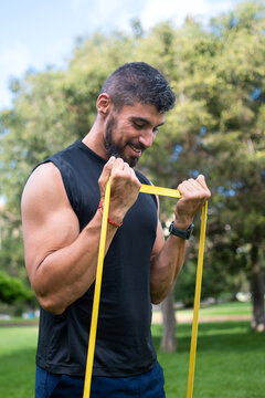 Man doing bicep curl with resistance band