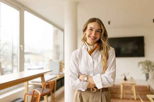 Confident businesswoman shows a warm smile at home
