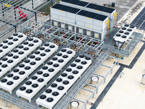 Aerial view of an industrial HVAC cooling system with rows of fans on the roof of a data center in Krakow, Lesser Poland Voivode, Poland.
