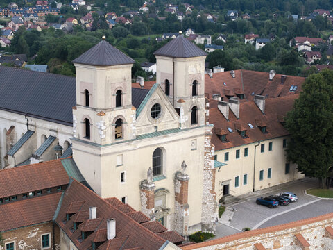 Aerial view of Benedictine Abbey in Tyniec with its historic twin towers, red-tiled roofs, and surrounding monastery buildings, Krakow, Wojewodztwo malopolskie, Poland.