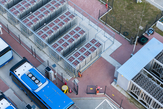 Aerial view of the LNG and CNG bus station with blue buses parked on a paved lot in Krakow, Lesser Poland Voivode, Poland.