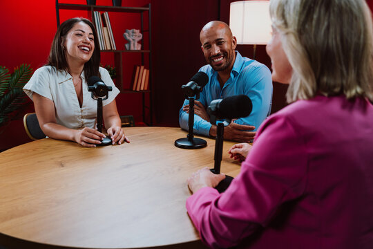 People recording a podcast interview in studio