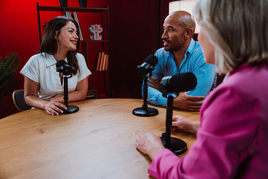 People recording a podcast interview in studio