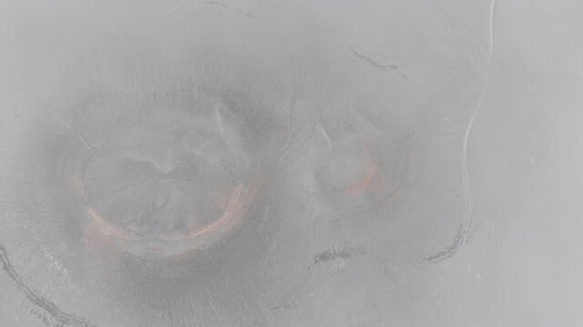 Aerial view of Landmannalaugar obscured by dense fog and mist in the highlands of Rangarthing ytra, Iceland.