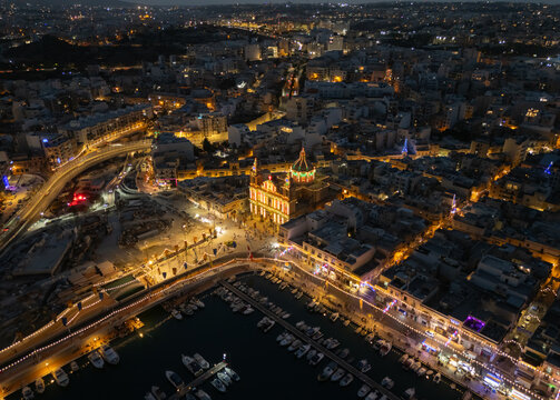 Aerial view of Msida marina and church during Malta village festa at night