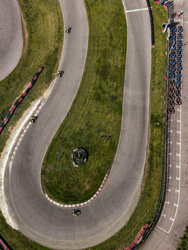 Aerial view of a kart racing competition at a track in Rozzano, Lombardy, Italy.