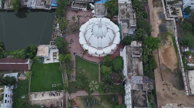 Aerial view of the Maizbhandar Darbar Sharif complex with its white lotus-shaped dome, surrounded by green lawns in Fatikchhari Upazila, Chittagong Division, Bangladesh.