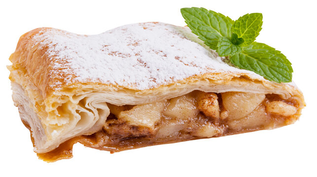Flaky apple strudel dusted with powdered sugar and mint leaf garnish