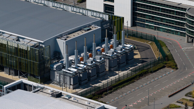 Aerial view of the Kao Data facility featuring industrial cooling units and modern infrastructure in Harlow, England, United Kingdom.