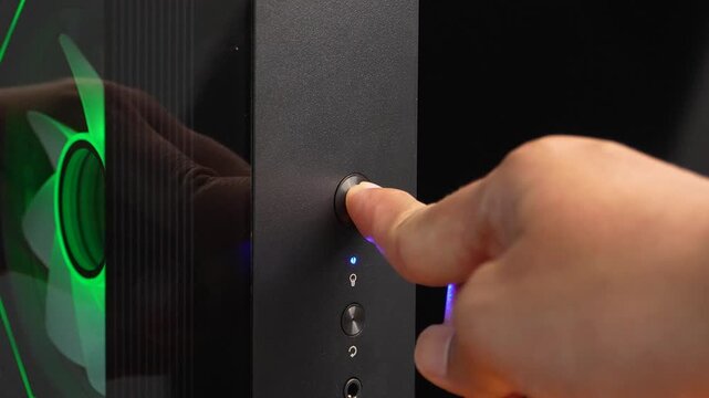 Finger pressing power button on desktop computer case