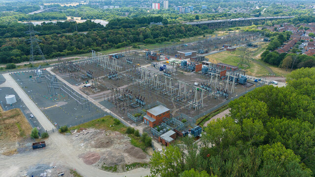 Aerial view of the National Grid Bustleholme Substation featuring electrical transformers and a lithium ion battery energy storage system in Walsall, England, United Kingdom.
