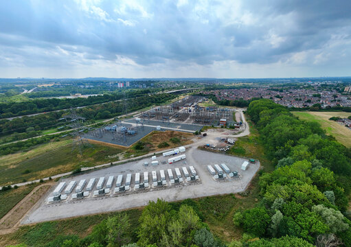 Aerial view of the National Grid Bustleholme Substation and lithium ion battery energy storage system with rows of white containers in Walsall, England, United Kingdom.
