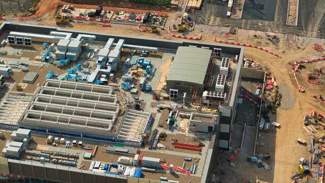 Aerial view of National Grid Hams Hall Substation and electricity transmission control centre under construction with industrial equipment and HVAC units in Birmingham, United Kingdom.