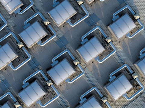 Aerial view of technical installations and ventilation systems on a factory roof in Dobczyce, Lesser Poland Voivode, Poland.