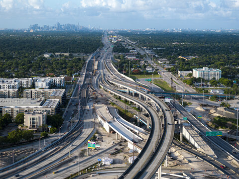Aerial view of the Golden Glades Interchange featuring complex highway ramps, construction zones, and surrounding urban infrastructure in Miami, Florida, United States.
