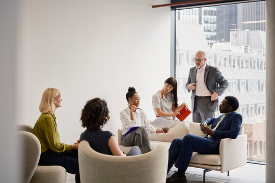 Business team discusses strategy during a meeting in a London office