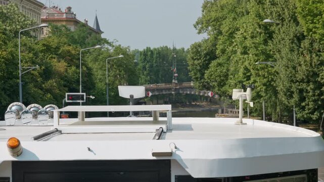 Marine navigation equipment and a wind speed sensor stand on a boat roof in Prague. Modern vessel electronics support safe river transport. Ideal for maritime technology and cruise travel.