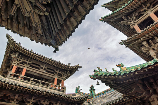 View of the traditional wooden architecture and ornate roof eaves of Yuci Ancient Town in Yuci, Shanxi, China.