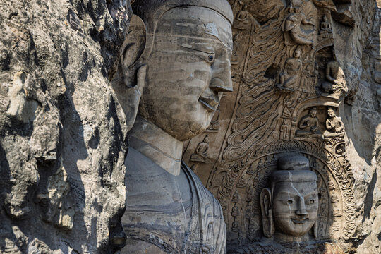 View of the intricate stone carvings of Buddha statues at the historic Yungang Grottoes in Datong, Shanxi, China.