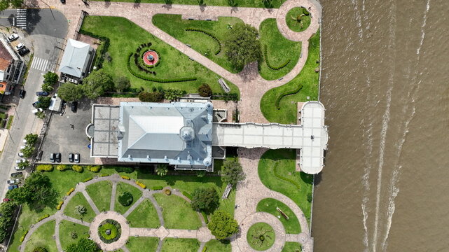 Aerial view of Museo de Arte de Tigre surrounded by manicured gardens and pathways along the riverbank in Tigre, Provincia de Buenos Aires, Argentina.