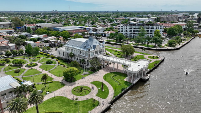 Aerial view of the Museo de Arte de Tigre with its ornate architecture, manicured gardens, and a long pier extending into the Lujan River in Tigre, Provincia de Buenos Aires, Argentina.