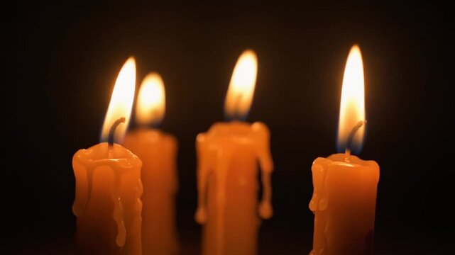 Halloween Candles with Dripping Wax Flickering in the Dark, Warm Orange Glow, Slow Motion