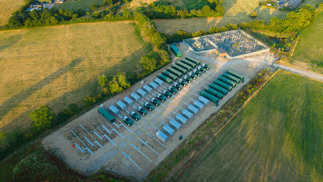 Aerial view of Enderby Substation National Grid and Battery Energy Storage Systems with rows of storage containers and electrical infrastructure in Leicester, England, United Kingdom.