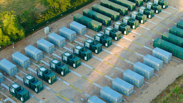 Aerial view of the Enderby Substation National Grid featuring rows of Battery Energy Storage Systems BESS containers arranged on a gravel lot in Leicester, England, United Kingdom.