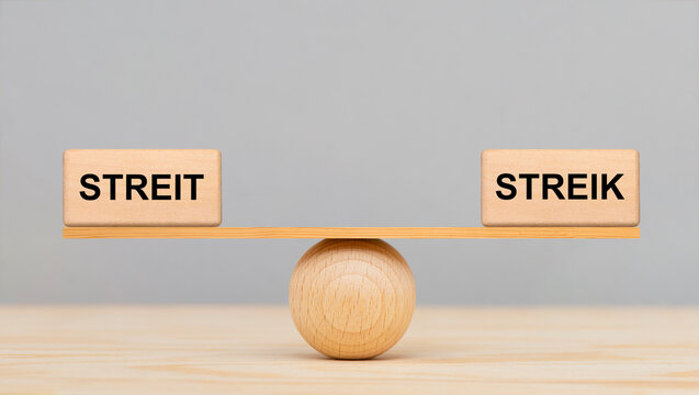 Streit und Streik liegen im Gleichgewicht auf einer Wippe