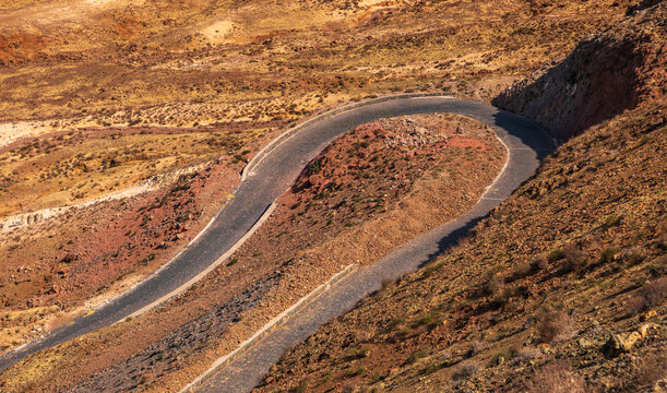 Aerial view of a winding mountain road through the arid rocky landscape of Santo Antao in Tarrafal de Monte Trigo, Porto Novo, Cabo Verde.