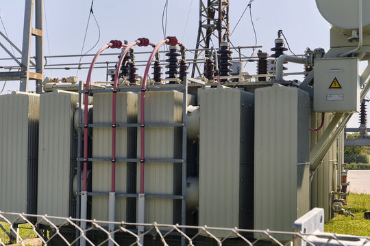 Nordborg, Denmark - 12 July 2026: View of the high voltage transformer station at the Danfoss factory with industrial electrical equipment, metal cooling fins, and power lines.