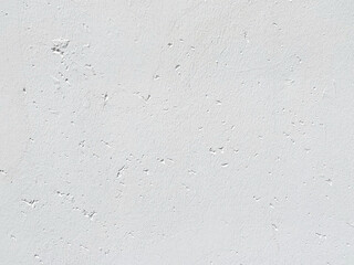 Fototapeta premium Verputzte weiße Wand mit Poren als Hintergrund mit Textfreiraum