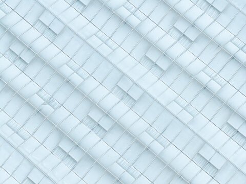 Aerial view of an industrial scale greenhouse with repeating glass panels and metal frames in Poland.