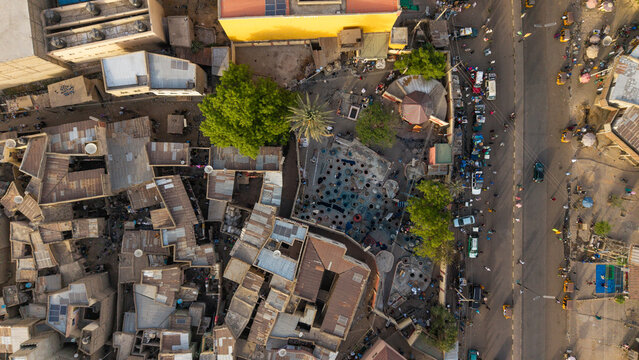 Aerial view of the historic Kofar Mata Dyeing Pits featuring traditional indigo dye pits and surrounding mud-brick buildings in Kano, Kano, Nigeria.