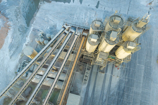 Aerial view of an industrial concrete plant featuring tall storage silos and conveyor belts for material processing in Las Vegas, Nevada, United States.