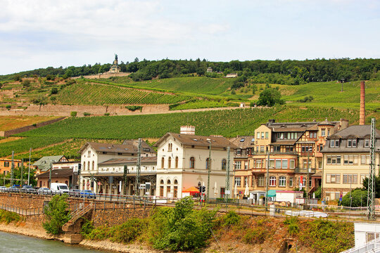 Rudesheim, Germany located on the Middle Rhine. A quaint town amongst vineyards with the Niederwald Monument in the distance on top of the hill which can be rached by scenic cable car