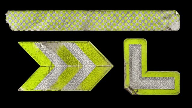 Worn reflective road marker pieces isolated on black background
