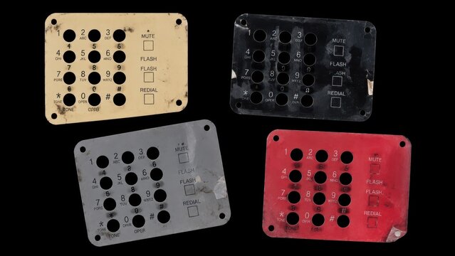 Four worn telephone keypad faceplates isolated on black