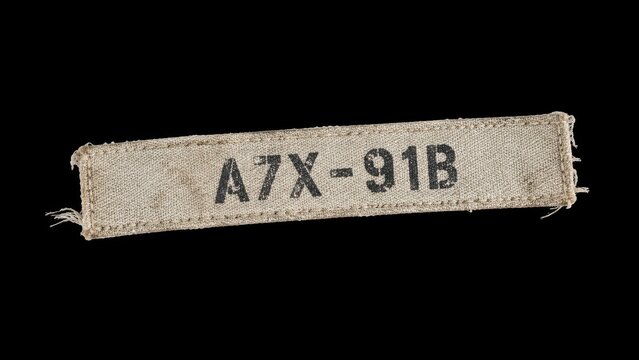 Fabric label with printed alphanumeric code on black background