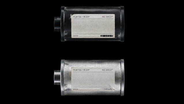 Two 35mm film canisters isolated on black background