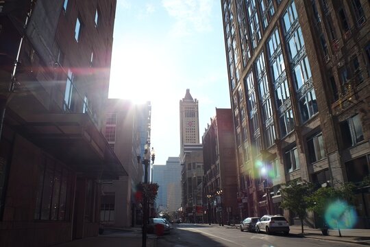 Urban landscape with tall buildings and bright sunlight in the city.