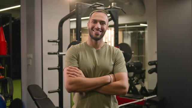 Cheerful African American man male fitness trainer inviting people to gym come here gesture sportsman standing crossed arms happy athlete welcoming to workout training healthy sports lifestyle in club