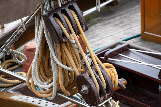 Traditional Wooden Sailing Block with Rigging Ropes on a Classic Sailboat