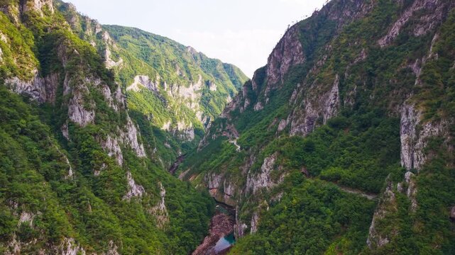 Majestic aerial view of the steep forested cliffs along Piva River canyon near Montenegro and Bosnia border