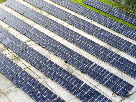 Aerial view of solar panels arranged in rows on a concrete surface in Krakow, Lesser Poland Voivode, Poland.
