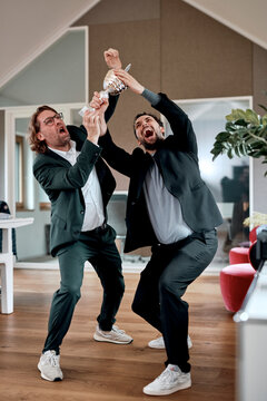 A businessman and his colleague fight over a trophy in the office