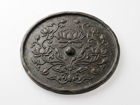 Antique Bronze Mirror Featuring Detailed Floral Lotus Pattern Relief Engraving from Ancient East Asian Cultural Heritage and Historical Craftsmanship