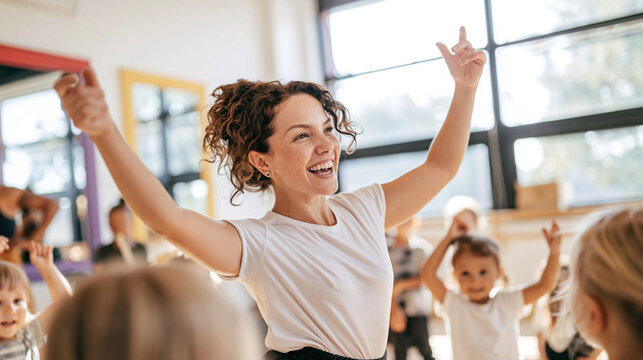 Teacher leading children in a joyful dance and movement class, learning together with happiness and fun in kindergarten