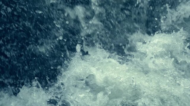 Beautiful ocean waves creating powerful splashes and flowing patterns in close-up view.