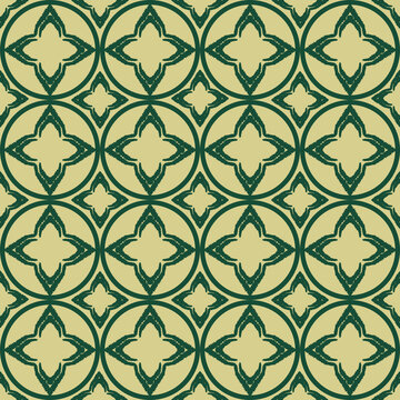 Green circular leaf motif seamless pattern on beige, nature inspired geometric background.